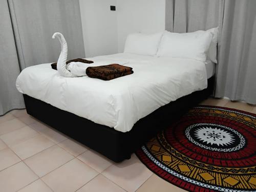 Postel nebo postele na pokoji v ubytování Villa Balmoral Suva