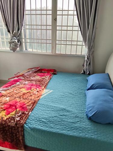 a bed sitting in a room with a window at cheap room near USM Georgetown in Pulau Pinang
