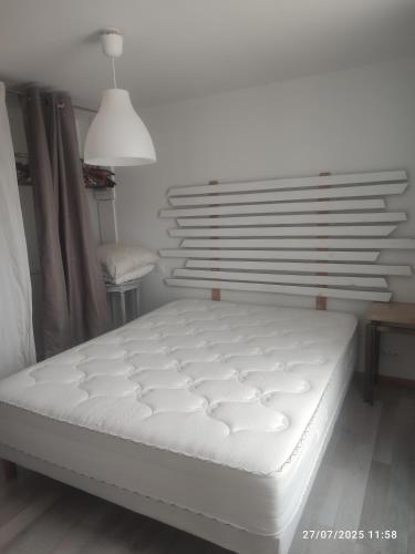 Llit o llits en una habitació de La maison des amis