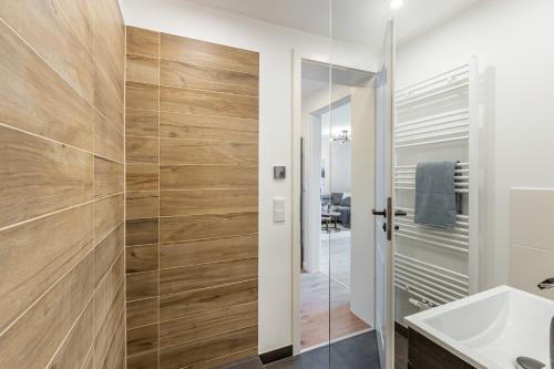 a bathroom with a shower and a sink at Rosels Mountain Lodge Pool Sauna Bergblick Oberaudorf in Oberaudorf