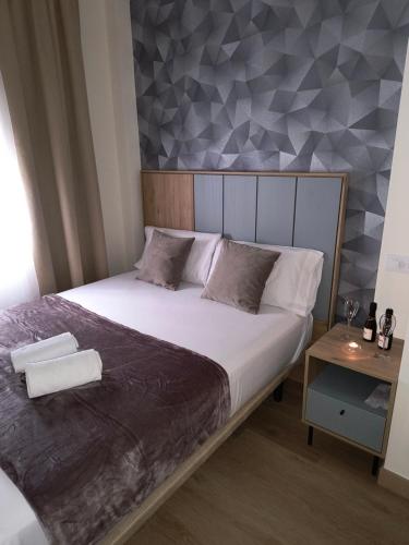 Letto o letti in una camera di Paradise Suites Madrid