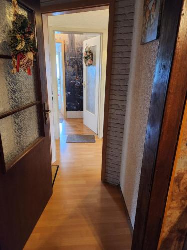 a hallway with a door leading into a room at Monteur Wohnung in Borgeln bei Soest in Welver