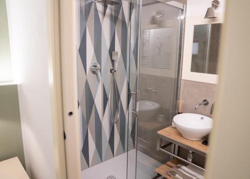 a bathroom with a shower and a sink at Il Torrione Relais in Sirolo
