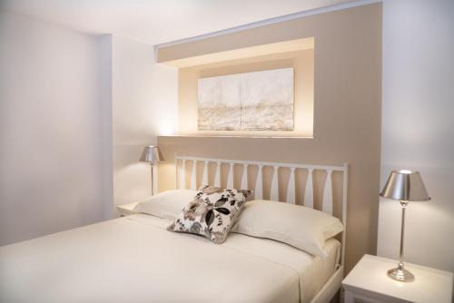 a bedroom with a bed with a pillow on it at Il Torrione Relais in Sirolo