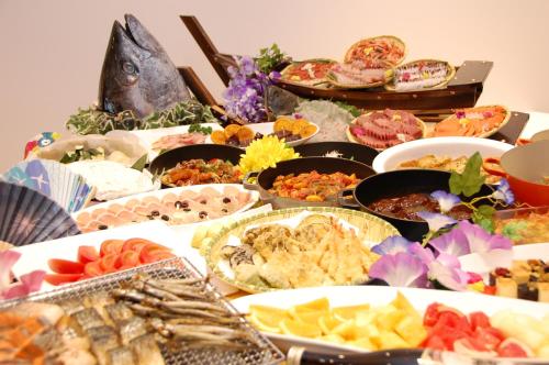 a table topped with lots of different types of food at Hotel Global View Hakodate in Hakodate