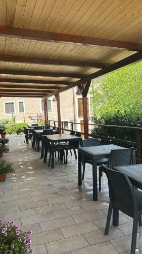 a row of tables and chairs on a patio at Agriturismo Nonno Ninuccio in Gioi