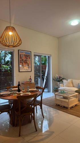 a living room with a table and a couch at Carlton 1910 Manly Hideaway in Sydney
