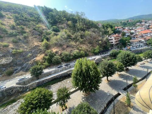 an aerial view of a street with cars and trees at Lina Apartment Prizren in Prizren