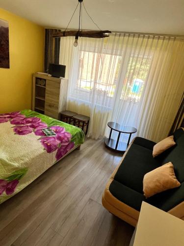 Llit o llits en una habitació de Poilsis pas Astą