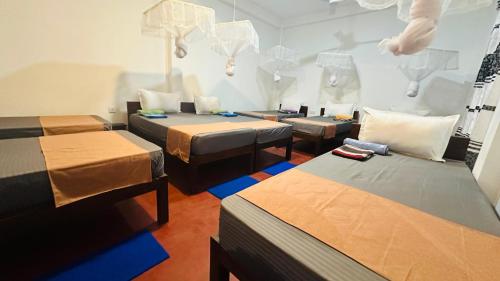 Ένα ή περισσότερα κρεβάτια σε δωμάτιο στο Cashew nut land hostel