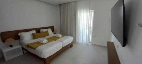 Tarra Seaside Hotelにあるベッド