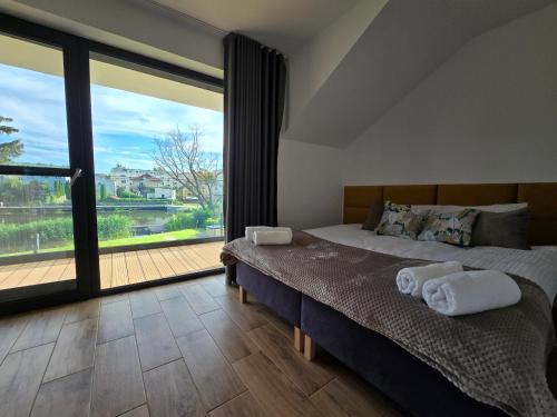 Postel nebo postele na pokoji v ubytování FLAUTA apartamenty