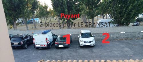 a group of cars parked in a parking lot at LE TRANSAT 40m de la plage in Palavas-les-Flots