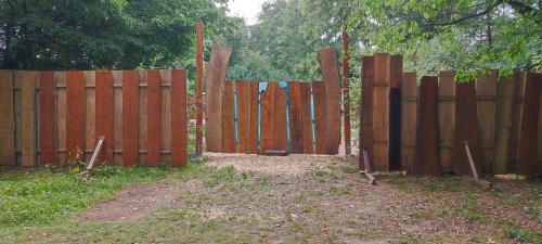 a wooden fence with a gate in front of it at Weddeloase in Medebach