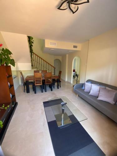 a living room with a couch and a table at Alojamiento Vista Hermosa in Ayamonte