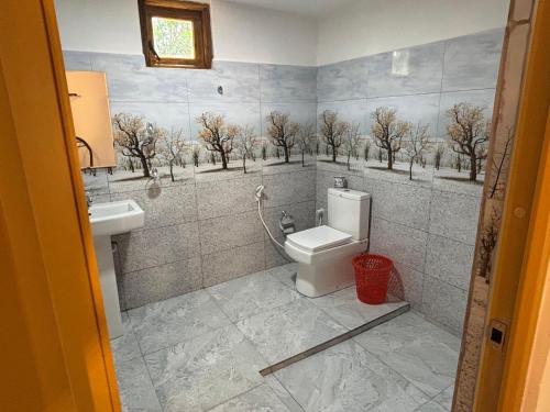 a bathroom with a toilet and a sink at Jungle Eco Lodge & Safari in Sigiriya