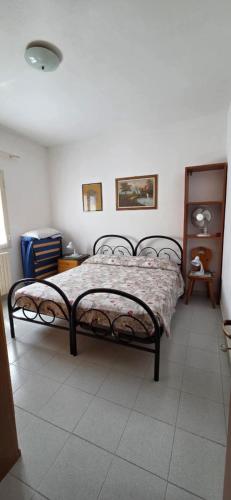 En eller flere senge i et værelse på Casa ERMINIA