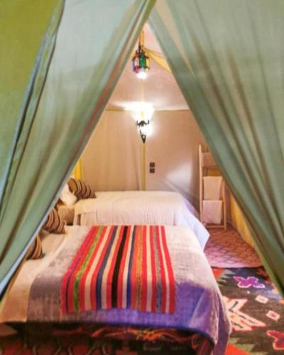 Postel nebo postele na pokoji v ubytování luxury safari camp