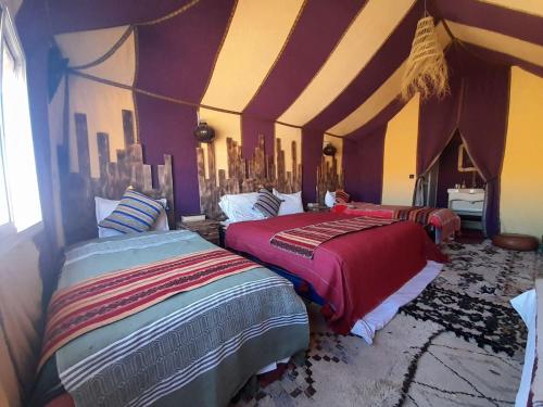 Postel nebo postele na pokoji v ubytování luxury safari camp