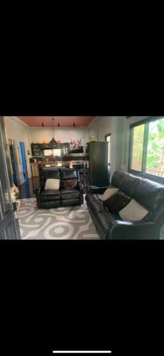 Ruang duduk di Spacious Beachfront House with Rooftop Deck in Macrohon, Philippines