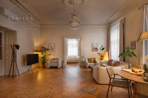 a large living room with couches and a table at Fragola Apartments Old Town in Kraków