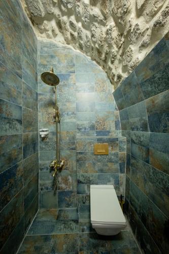 a bathroom with a shower with a toilet in it at AURA TAŞ Hotel in Urfa