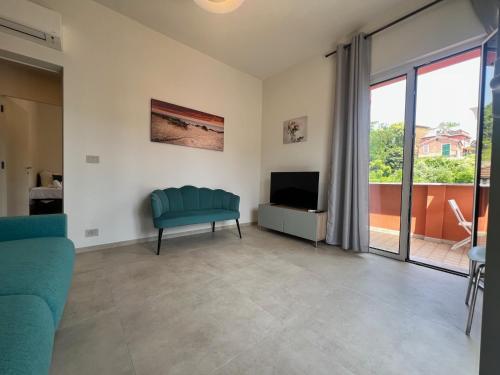a living room with a couch and a tv at Family apartment in Rapallo