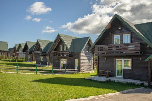 a row of houses in a row at Sunny Village - Vila Rabbit in Žabljak