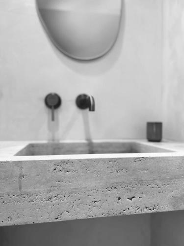 a bathroom sink with a faucet and a mirror at Casa mimo units altea in Altea