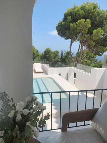 a view from the balcony of a villa with a swimming pool at Casa mimo units altea in Altea