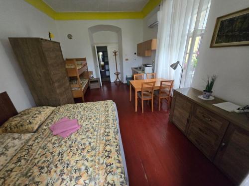 a bedroom with a bed and a desk and a table at Fara Choustníkovo Hradiště in Choustníkovo Hradiště