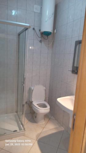 a bathroom with a toilet and a sink at Sal Rei apartaments, Boa Vista, free WI-FI in Sal Rei