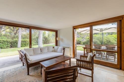 a living room with a couch and a table at Villa Dei Pini in Casa Mora