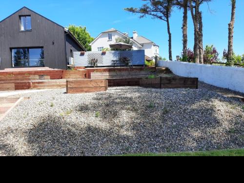 a house with a gravel yard with a house at The Rebel Yew in Killala