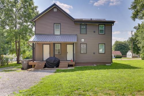 a house with a front porch and a lawn at 3 Mi to Dtwn Quiet Youngstown Apt with Deck! in Youngstown