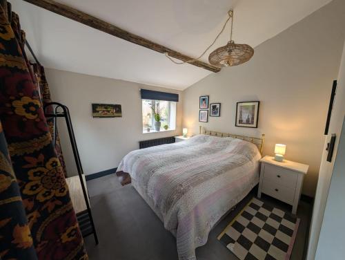 Ένα ή περισσότερα κρεβάτια σε δωμάτιο στο Grosvenor Studio Apartment