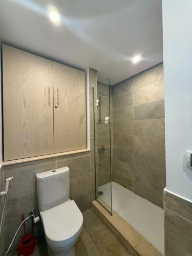 a bathroom with a toilet and a shower at Zafero marassi FOR FAMILIES ONLY NO COUPLE- weekend without sea in El Alamein