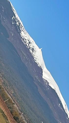a snow covered mountain with the sky in the background at PROVENCE, MAISON SPACIEUSE et CONFORTABLE CLOSE TO SPIROU , WAVE ISLAND in Monteux