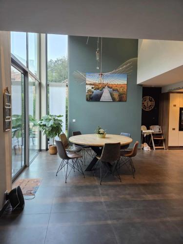 a dining room with a table and chairs at La Clé du Circuit Spa-Francorchamps in Stavelot