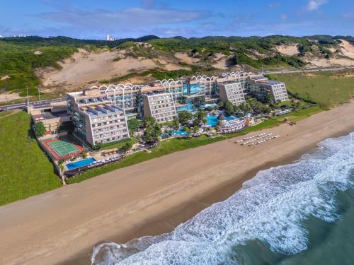 an aerial view of the resort and the beach at SERHS Experience Suítes in Natal