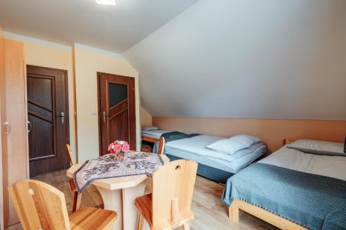 Postel nebo postele na pokoji v ubytování Apartament pod Glinikiem