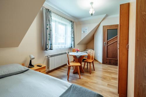 Postel nebo postele na pokoji v ubytování Apartament pod Glinikiem
