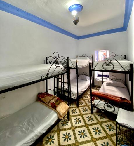 Un ou plusieurs lits dans un hébergement de l'établissement Hostal La Joya