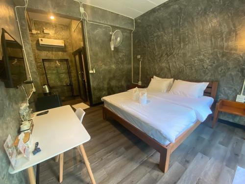 Postel nebo postele na pokoji v ubytování Morning ธารทอง เชียงใหม่