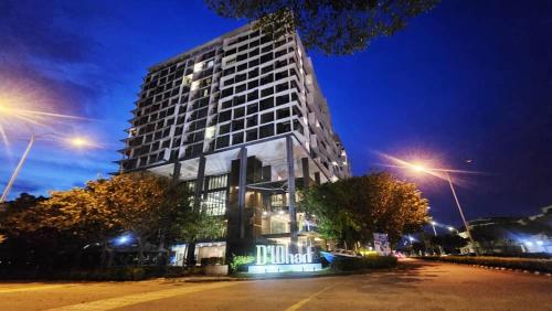 a building with a sign on the side of it at PD D'Wharf The Bay Superior Queen Room SeaView Balcony in Port Dickson