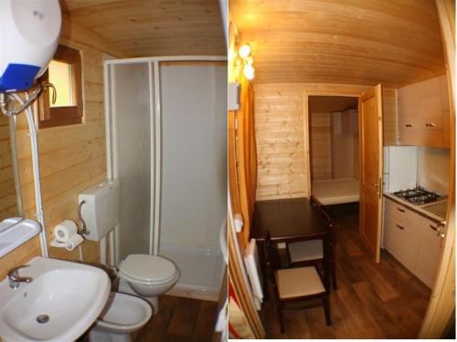 a bathroom with a sink and a toilet in a room at Camping Yoghi e Bubu in San Giacomo
