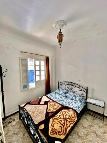 Un ou plusieurs lits dans un hébergement de l'établissement Hostal La Joya