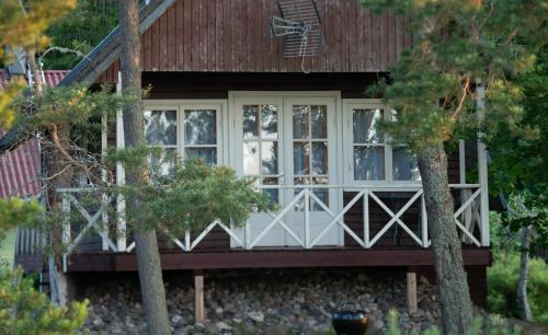 a house with a large window on the front of it at Ranniku Holiday House in Rannaküla