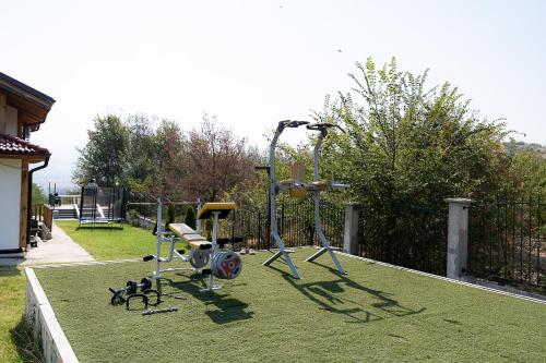 a park with a playground with a swing at AMAZING view, privacy and comfort - SPA Villa Krasi in Blagoevgrad
