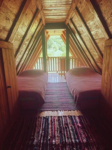 a bedroom with two beds in a attic at Vikendica Tamara in Berane